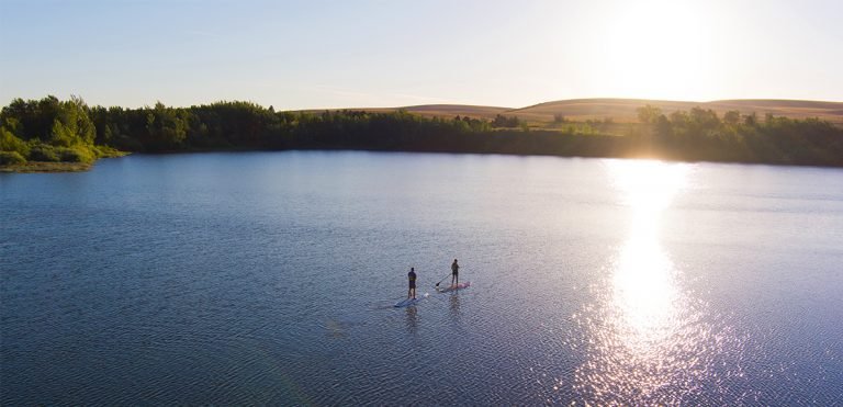 Summer morning paddleboarding at Bennington Lake